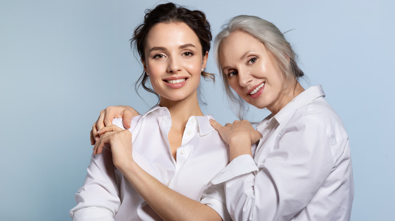 Two women hugging each other