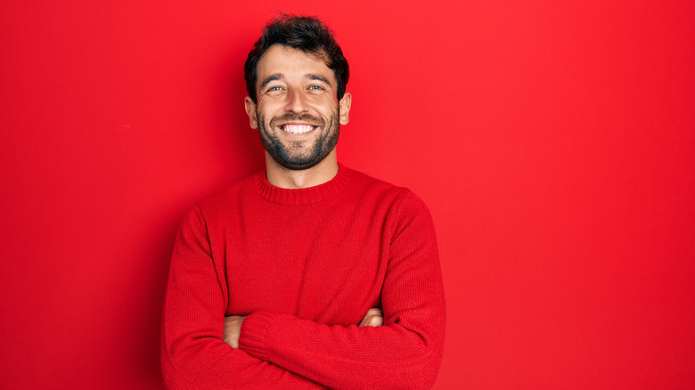 Man in red shirt smiling