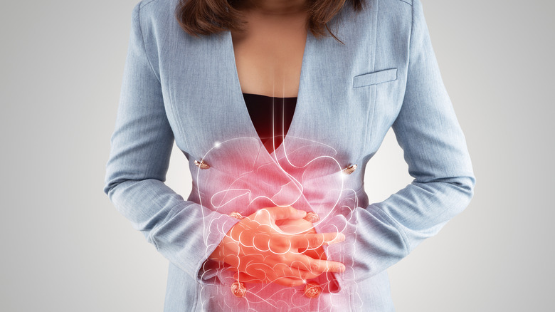 Woman suffering from abdominal pain from Crohn's disease