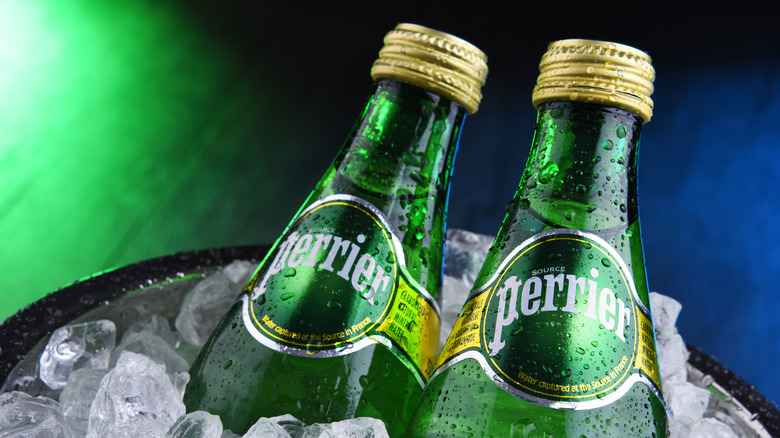 Two bottles of Perrier in ice bucket