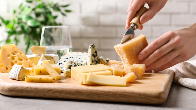 slicing parmesan cheese