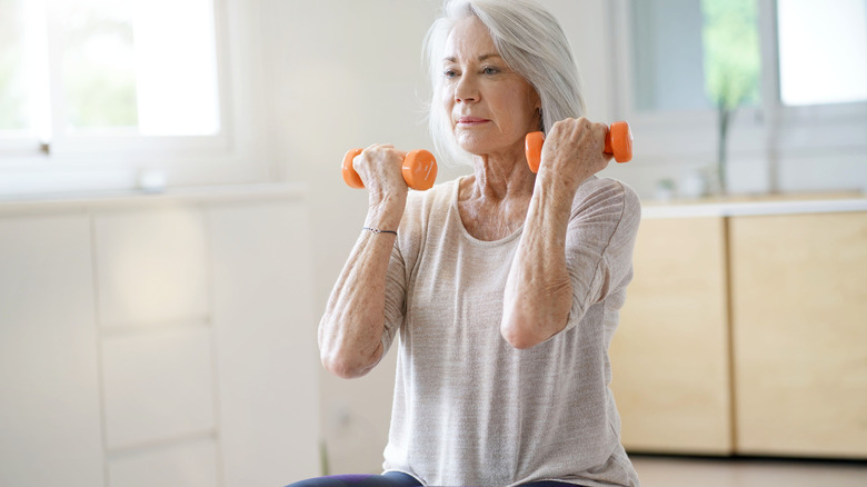 elderly woman lifting weights