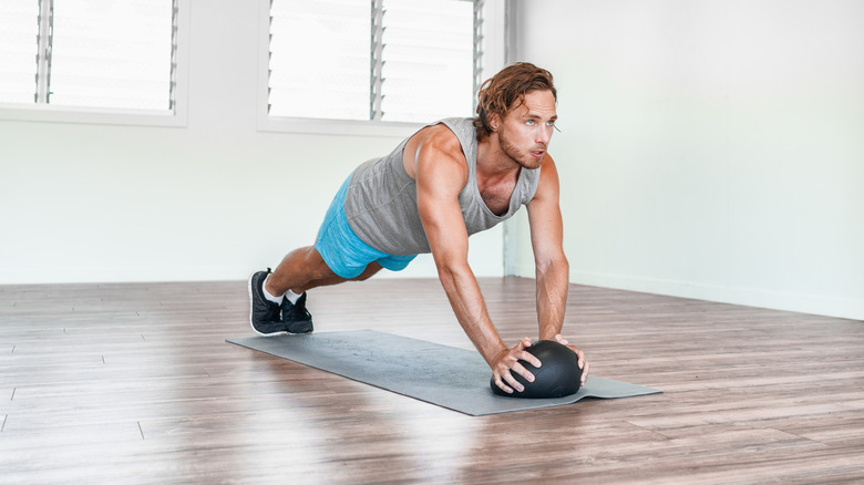 Man on exercise mat