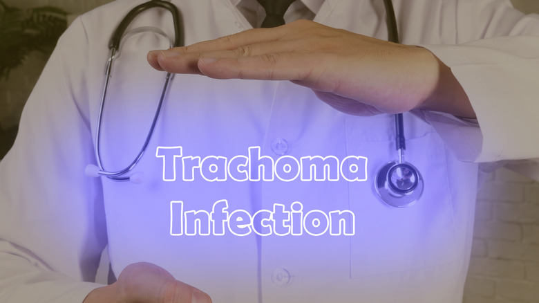 doctor holding trachoma signage