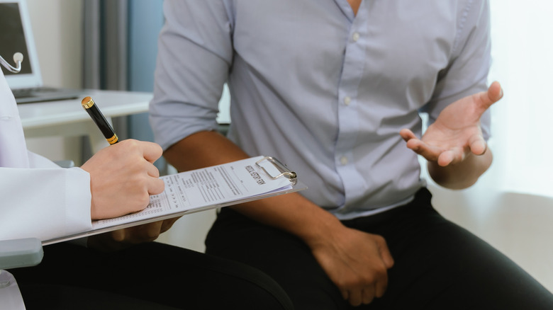 man talking with his doctor