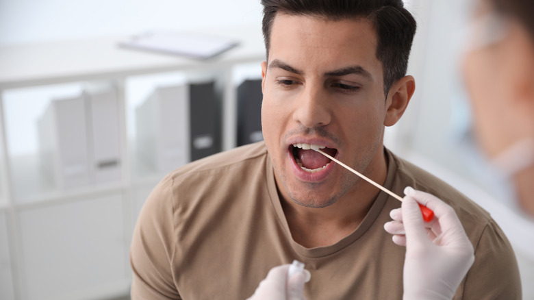 Man getting cheek swab 
