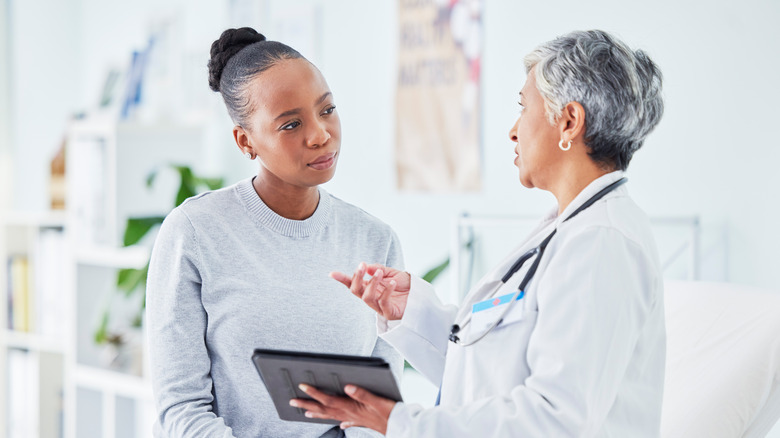 Doctor speaking to patient