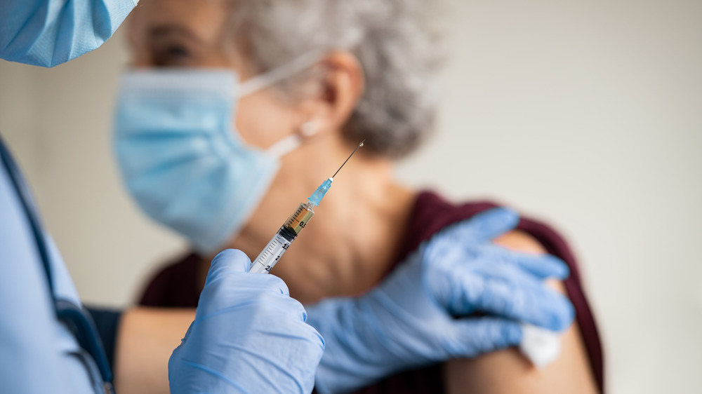 Woman being vaccinated 