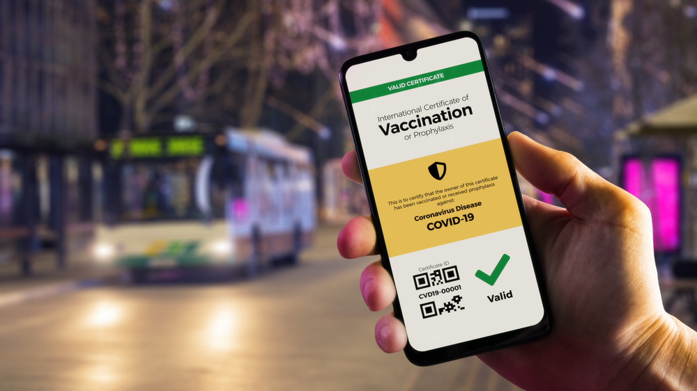 COVID-19 vaccination approval certificate shown on phone