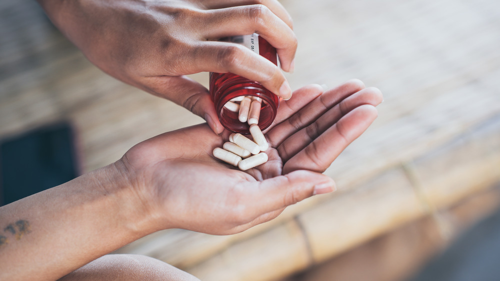 Pills being poured out of a bottle