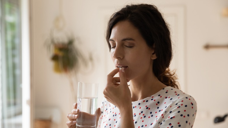 woman taking medication