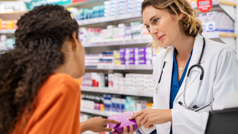 pharmacist talking to customer