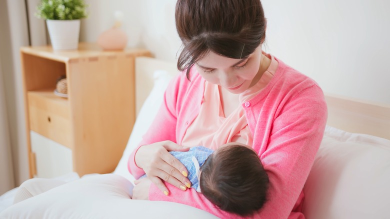 woman breastfeeding baby