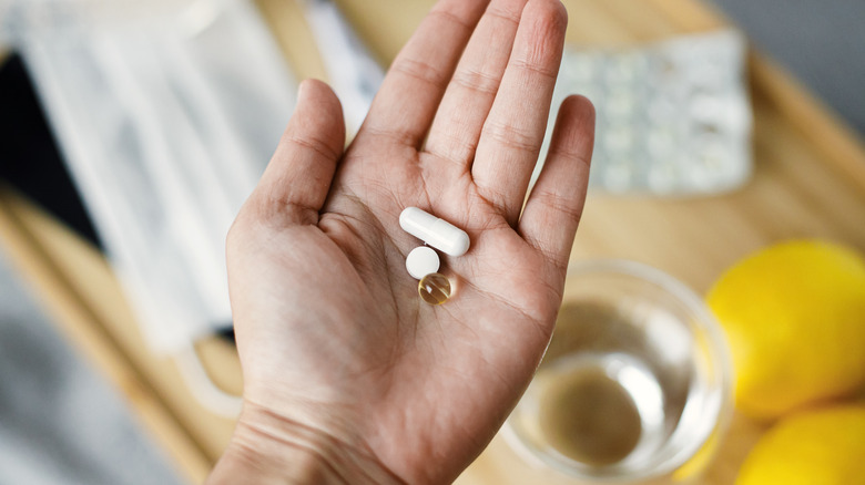 A person holds supplements