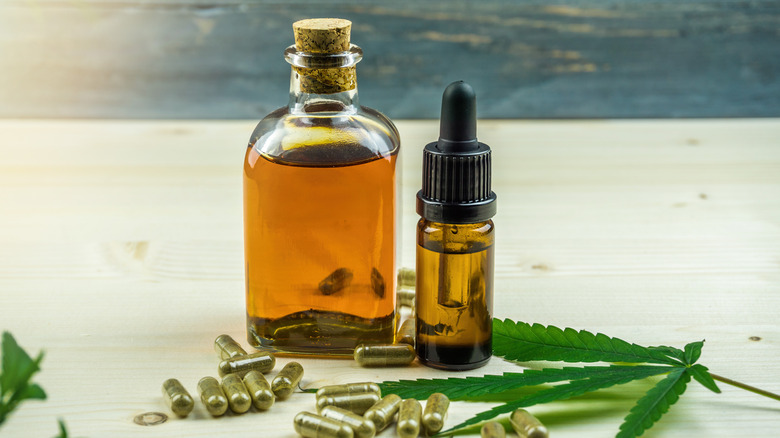 bottles and capsules with hemp leaf