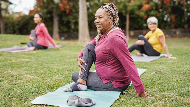 People doing yoga outside