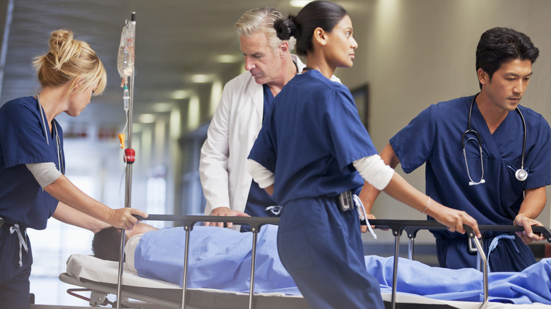 patient being bagged on hospital gurney