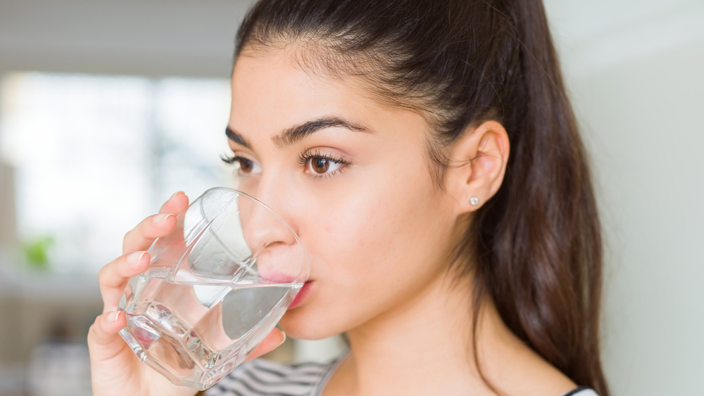woman drinking glass of water
