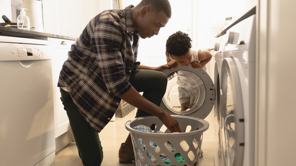 Father and son doing laundry
