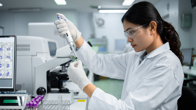researcher analyzing blood samples