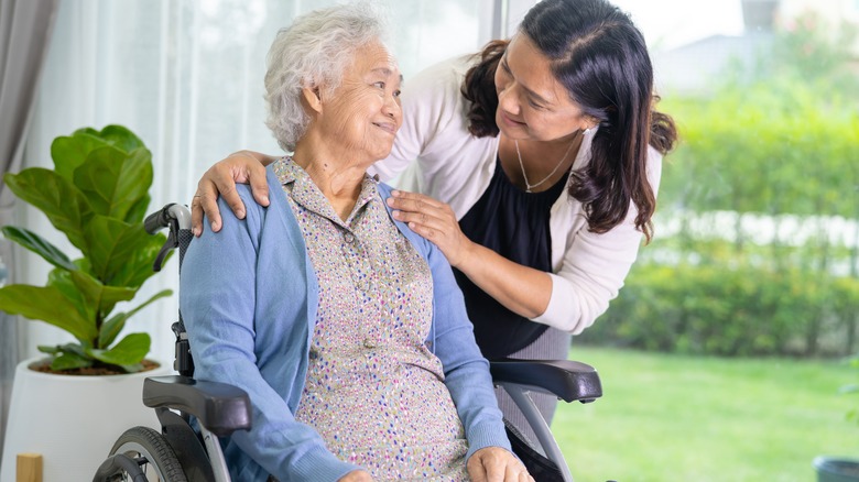 Senior citizen smiling at visitor