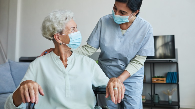 Healthcare worker smiling at senior