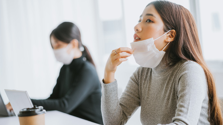 women masking indoors