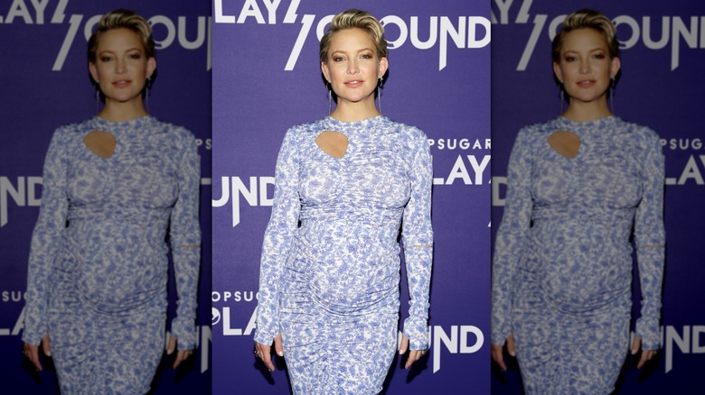 Kate Hudson posing in a blue dress