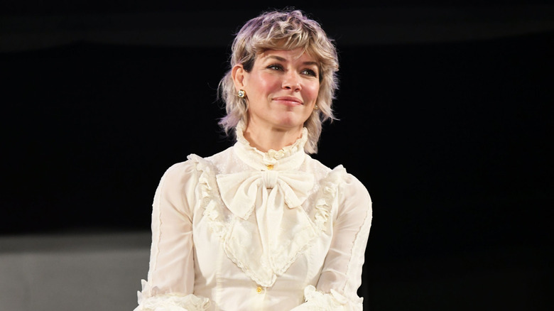 Evangeline Lilly in a white blouse