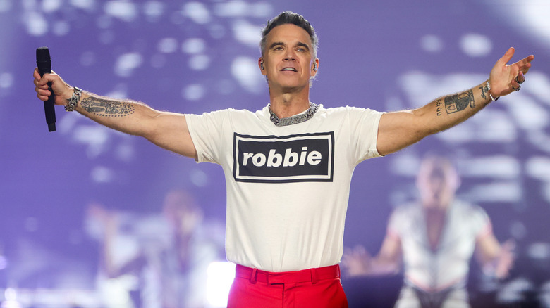 Robbie Williams performing
