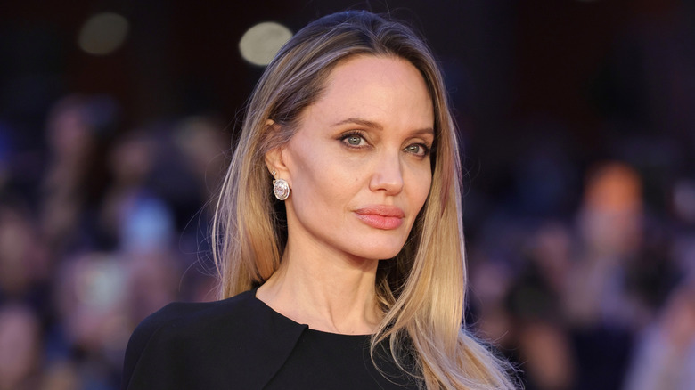 Angelina Jolie posing in a black outfit