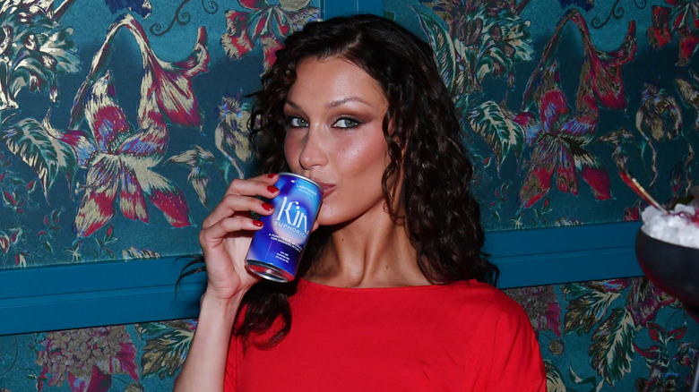 Bella Hadid drinking Kin Euphorics non-alcoholic beverage while attending the grand opening of Stanton Social Prime at Caesars Palace