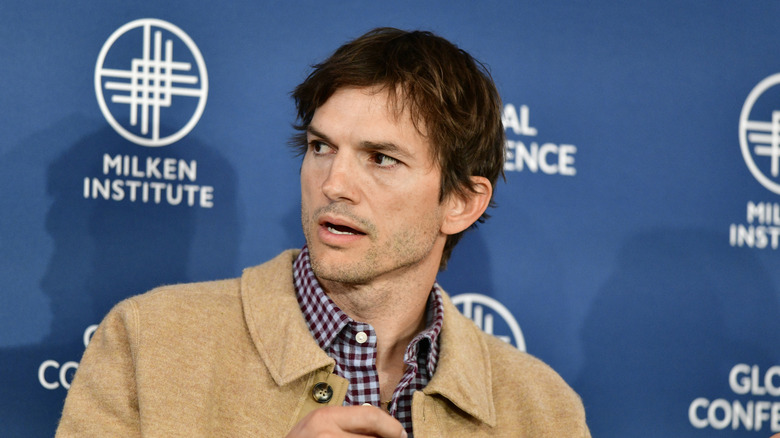 Ashton Kutcher being interviewed at a public event