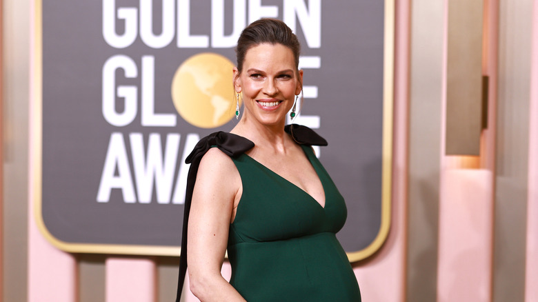 Hilary Swank cradling her baby bump