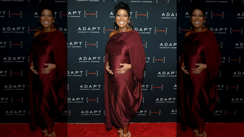 Tamron Hall cradling her baby bump