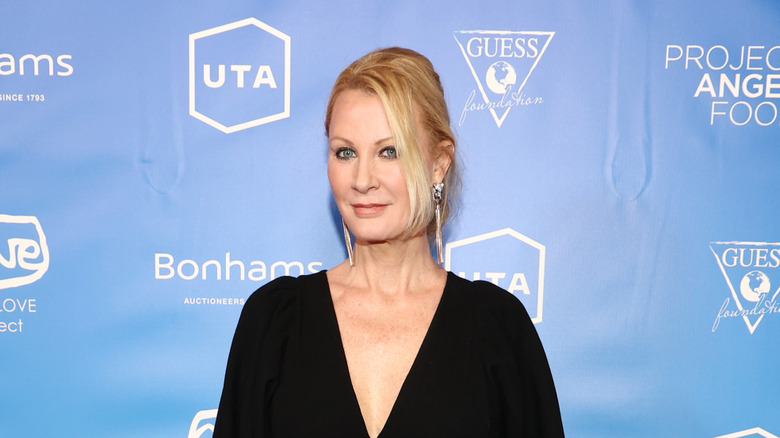 Sandra Lee posing in a black dress