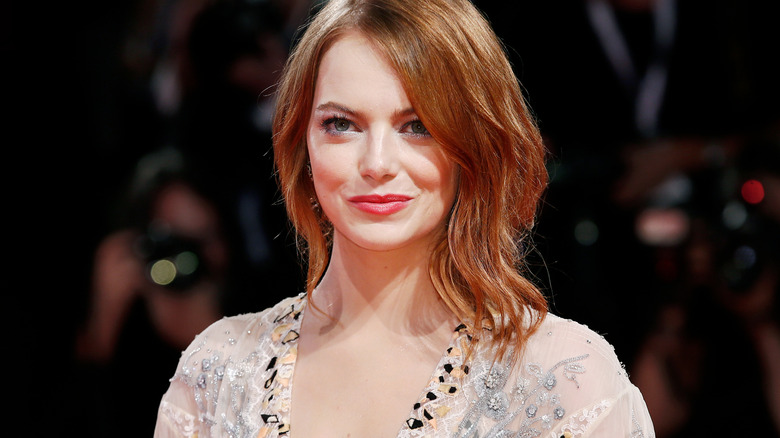 Emma Stone poses for photographers