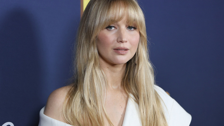 Jennifer Lawrence posing for reporters on the red carpet