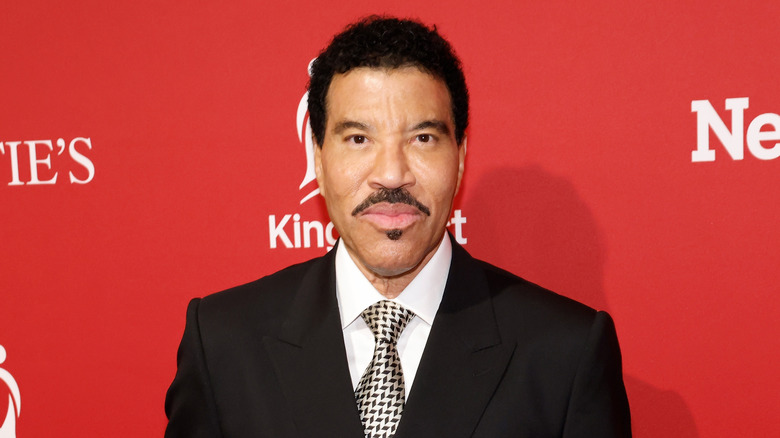 Lionel Richie posing in a suit