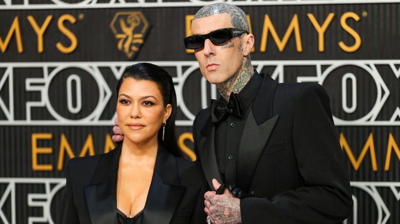 Kourtney Kardashian Barker and Travis Barker posing