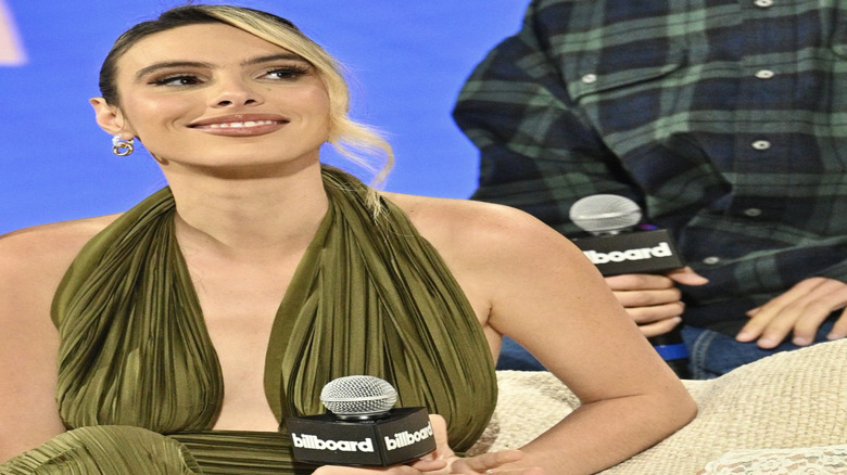 Lele Pons smiling and looking away