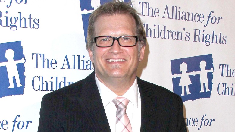 Drew Carey in black suit