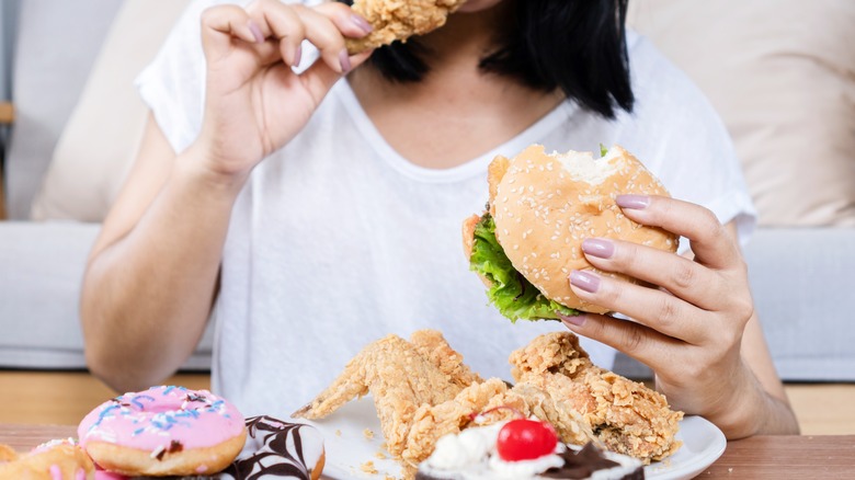 A woman eating fried food