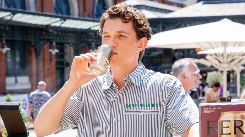 Tom Holland sipping BERO beer at the BERO x Shopify pop up event at Covent Garden