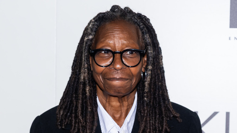 Whoopi Goldberg looking to the side