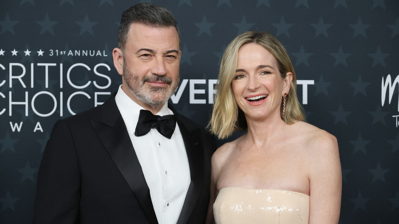 Jimmy Kimmel and Molly McNearney standing for pictures at a star event