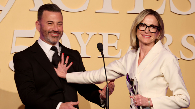 Jimmy Kimmel and Molly McNearney joking onstage at award event