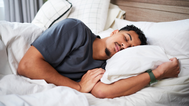 sleeping man with smile on his face