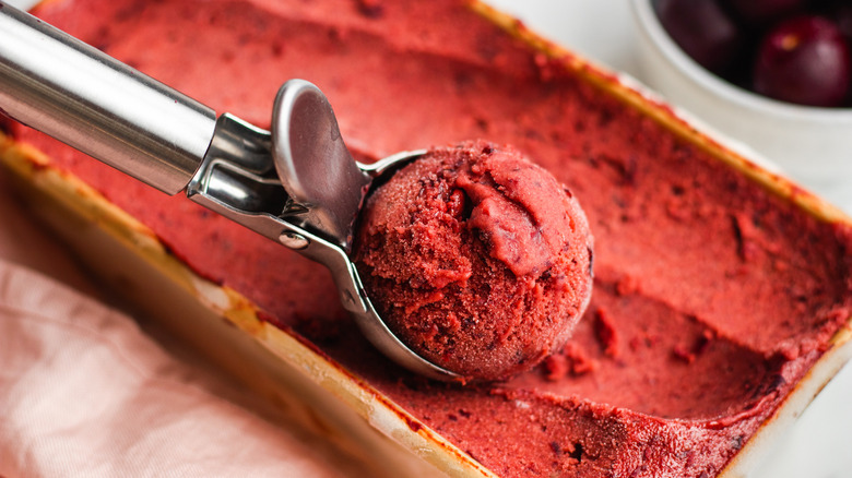 Cherry ice cream in a wooden bowl