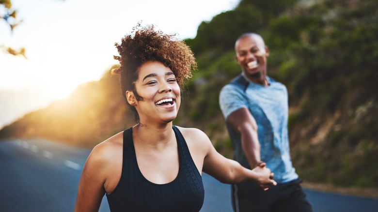 Happy couple running